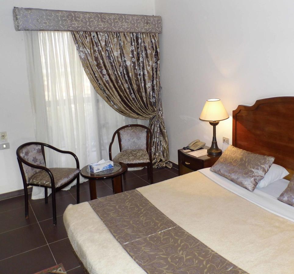 Mg Nefertiti Hotel Ель-Мінья Номер фото